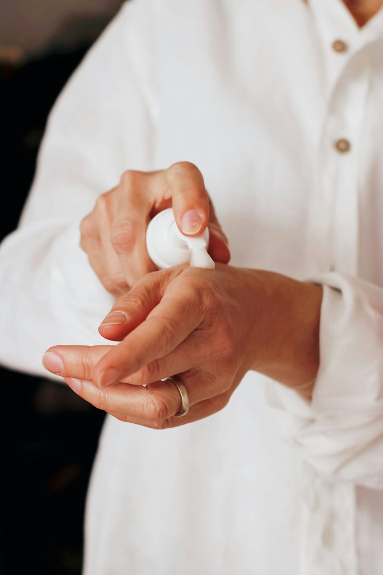 Moisturiser being pumped into the palm of a hand