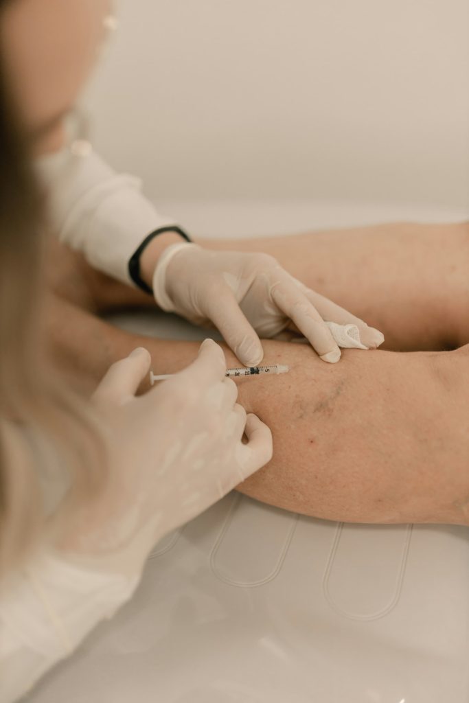 Gloved hands performing a minor skin procedure