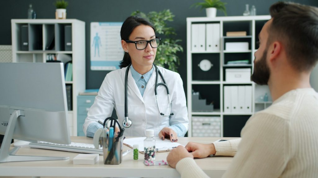 Doctor talking with a patient in a consulting room