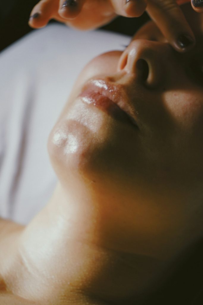 Facial massage along the jaw and cheek
